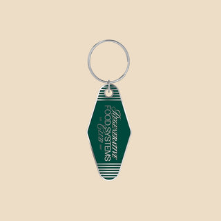 Front of Regenerative Food Systems Club green metal keychain.