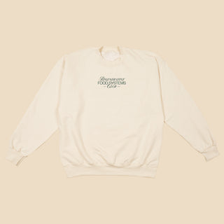 Front of cream-colored crewneck sweatshirt with Regenerative Food Systems Club logo printed on the chest.