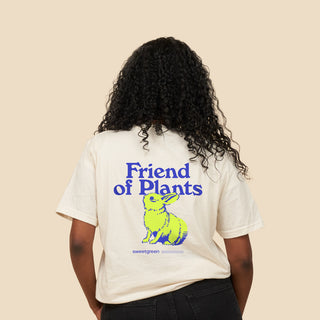 Back of person wearing tee with Friend of Plants graphic on the back.