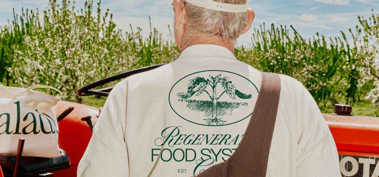 Person looking away from camera wearing Regenerative Food Systems Club Crewneck and Two Tone hat.