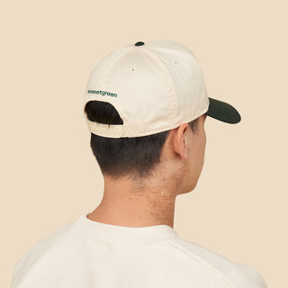 Person facing away from the camera showing the "Sweetgreen" logo on the back of the Two Tone hat.