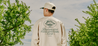 Person with back to camera wearing Regenerative Food Systems Club Crewneck sweatshirt and Two Tone Hat.
