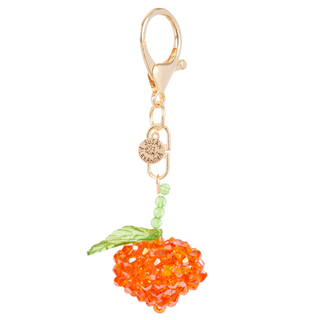 Beaded peach-shaped bag charm with gold-plated lobster clasp.